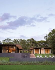 Residential home 'Stony Hill' surrounded by orange grass, on grey linen cover of 'Architecture of Place, 'Bates Masi + Architects, by ORO Editions.