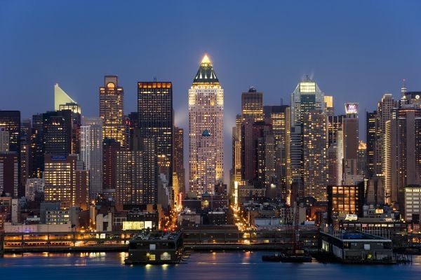 Book cover of Developing: My Life William Zeckendorf, featuring the American real estate developer on a building site, grinning, with foot on shovel. Published by ORO Editions.