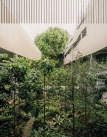 High rise building in orange, on cover of 'Renovating Carbon', by ORO Editions.