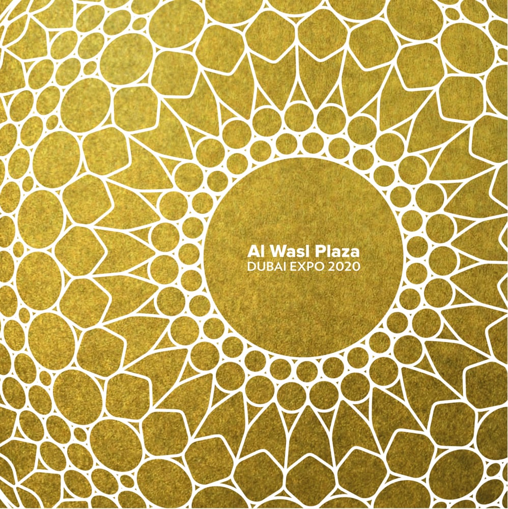 Gold cover with white geometrical spiral latticed pattern, Al Wasl Plaza Dubai Expo 2020 in white font to centre.