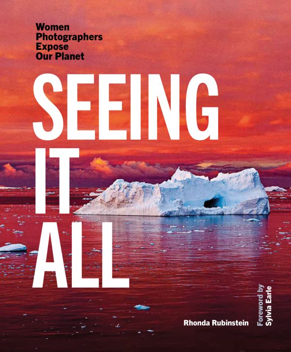 Book cover of Seeing It All, Women Photographers Expose our Planet, with a large iceberg floating on sea, under orange sky. Published by ORO Editions.