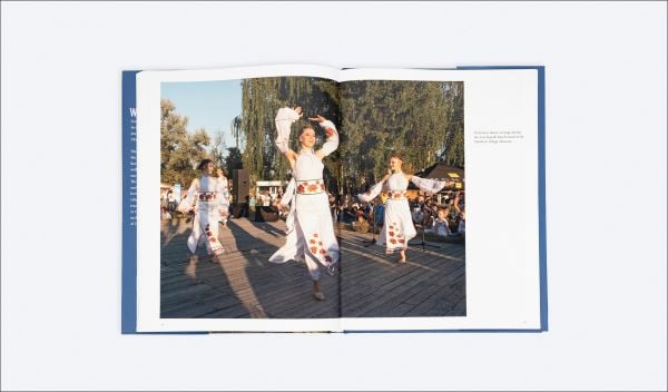 Book cover of Beloved Ukraine, Photographs by Paul Chesley, with a girl with long flowing hair wearing a floral headpiece. Published by ORO Editions.