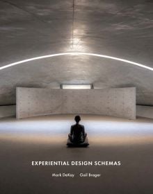 Book cover of Experiential Design Schemas, with a figure sitting cross-legged on cushion, in domed building space with strip of light above. Published by ORO Editions.
