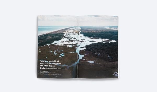 Book cover of Jeffrey Huber's Salty Urbanism: a design manual to address sea level rise and climate change for urban areas in the coastal zones, with person holding umbrella, wading through water in a city. Published by ORO Editions.