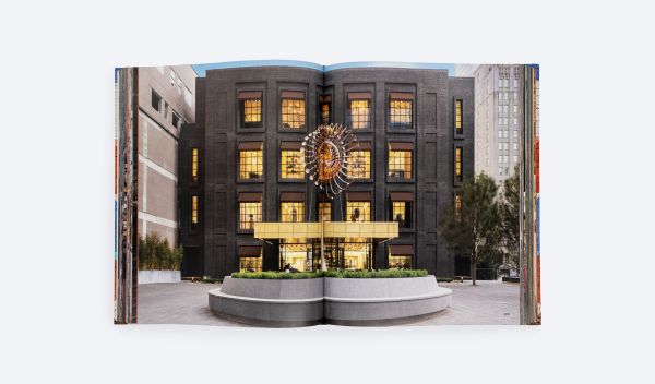 Brick wall painted with colourful triangular shapes, on cover of 'Droese Raney x Design', by ORO Editions.