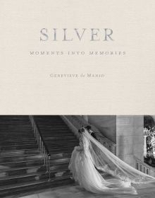 Book cover of Silver: Moments into Memories, with a couple in wedding attire walking up the steps of a grand hall. Published by ORO Editions.