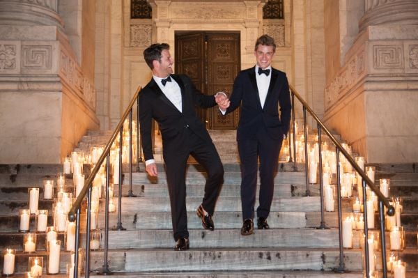 Book cover of Silver: Moments into Memories, with a couple in wedding attire walking up the steps of a grand hall. Published by ORO Editions.