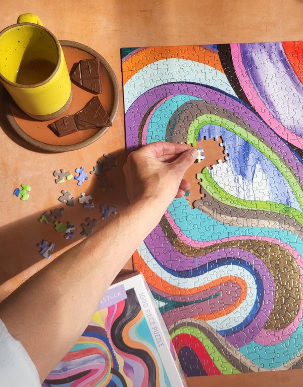 Box of and this feeling: 1000 piece puzzle; featuring a brightly-colored artwork. Published by Kinstler.