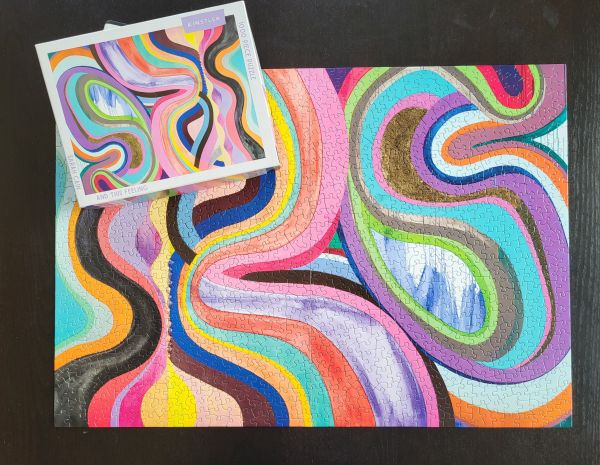 Box of and this feeling: 1000 piece puzzle; featuring a brightly-colored artwork. Published by Kinstler.