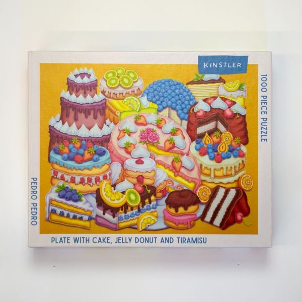 Puzzle box of Plate with Cake, Jelly Donut and Tiramisu: 1000 piece puzzle. Published by Kinstler.