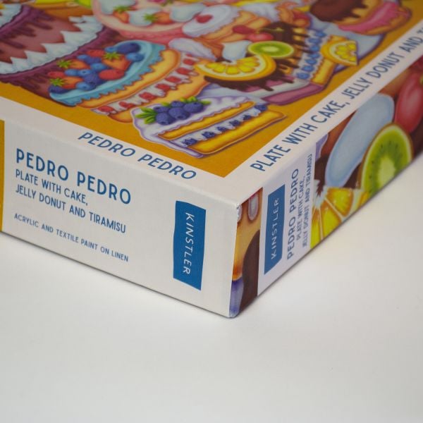 Puzzle box of Plate with Cake, Jelly Donut and Tiramisu: 1000 piece puzzle. Published by Kinstler.