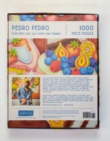 Puzzle box of Plate with Cake, Jelly Donut and Tiramisu: 1000 piece puzzle. Published by Kinstler.