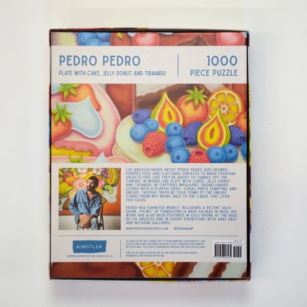 Puzzle box of Plate with Cake, Jelly Donut and Tiramisu: 1000 piece puzzle. Published by Kinstler.