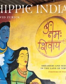 Book cover of David Zurick's Hippie India: Dreamers and Seekers in the Land of Nirvana, with a wall mural of two figures with their eyes closed. Published by ORO Editions.