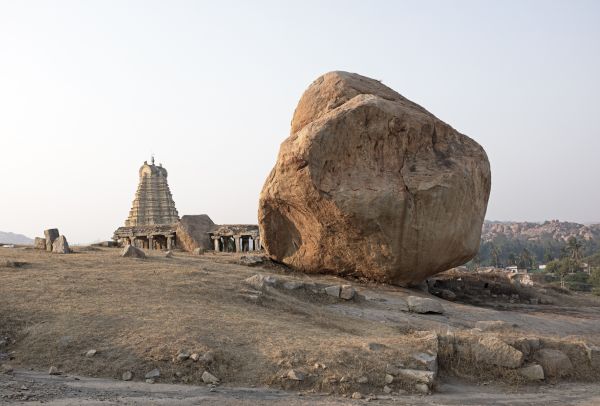 Book cover of David Zurick's Hippie India: Dreamers and Seekers in the Land of Nirvana, with a wall mural of two figures with their eyes closed. Published by ORO Editions.