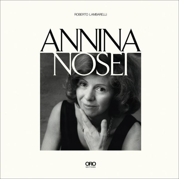 Book cover of Annina Nosei, featuring the gallerist smiling at the camera. Published by ORO Editions.