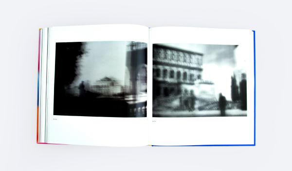 Book cover of All a Blur: Photographs from the Infinity Series; featuring a blurred silhouette of a person. Published by ORO Editions.