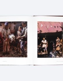 Book cover of Lost Nepal: A Photographic Memoir; featuring a figure standing in front of a hut with thatched roof, and misty mountains behind. Published by ORO Editions.