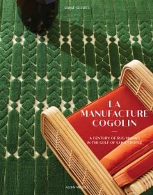 Book cover of La Manufacture Cogolin: A Century of Rug Making in the Gulf of Saint Tropez, with a wicker armchair with orange upholstery. Published by Albin Michel.