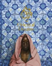 Black male dressed in pink robe, with blue mosaic tiles behind, on cover of 'Oriental Dreams', by Editions Norma.