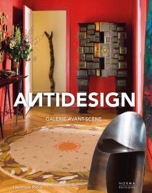 Interior living space with red walls, dark wood sculptures, on cover of 'Antidesign', by Editions Norma.
