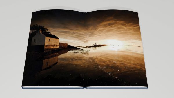 Book cover of Best of Brittany; featuring two figures on large rocks, heading out into the ocean. Published by Editions Florentin.