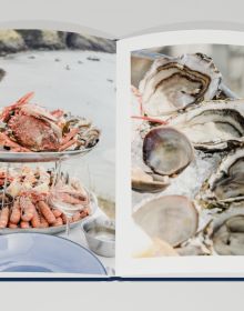 Book cover of Best of Brittany; featuring two figures on large rocks, heading out into the ocean. Published by Editions Florentin.