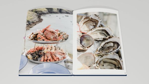 Book cover of Best of Brittany; featuring two figures on large rocks, heading out into the ocean. Published by Editions Florentin.