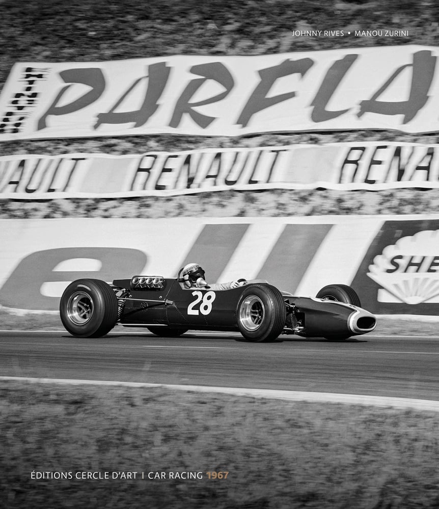 Black and white action photograph of a sports car featuring the number 28 on the side on a racing track with motoring advertisements in the background and Johnny Rives Manou Zurini Editions Cercle D'Art Car Racing 1967 in white and beige