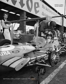 Book cover of Car Racing 1969, featuring racing driver sitting in jacked up car with no wheels. Published by Editions Cercle d'Art.
