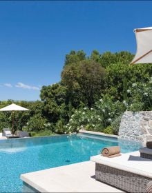 Book cover of Mediterranean Living: By Francobelge Interiors, with a Mediterranean villa with swimming pool. Published by Beta-Plus.