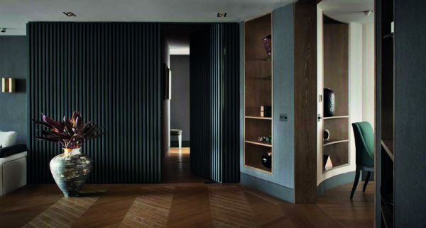 Surreal interior space with rotated staircase, gold and white objects floating in air, on black cover, of 'Thomas Griem, Homes', by Beta-Plus.