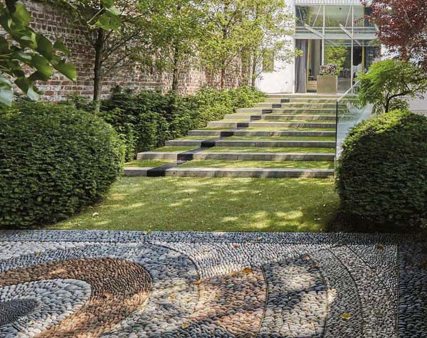 Book cover of Michel Delvosalle Garden & Landscape Architect, with a green landscaped garden with curved waterway. Published by Beta-Plus.