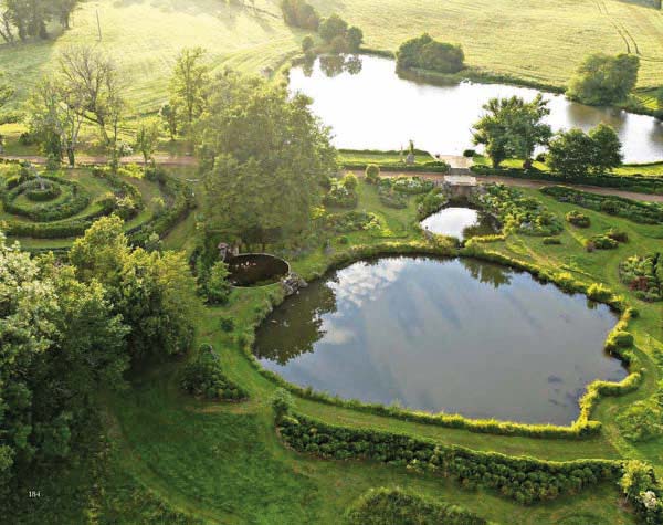 Book cover of Michel Delvosalle Garden & Landscape Architect, with a green landscaped garden with curved waterway. Published by Beta-Plus.