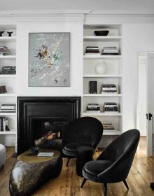 Interior dining space with wood table and chairs, high ceiling, low light fitting, on cover of 'Understated Elegance, New Urban Living', by Beta-Plus.