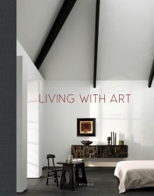 Bedroom interior with high beamed ceiling, framed art on wall, on cover of 'Living With Art', by Beta-Plus.