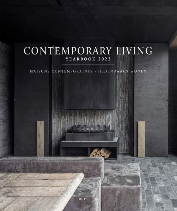 Book cover of Contemporary Living Yearbook 2023, with a dark grey interior of slate tiles, and a modern steel fireplace with logs. Published by Beta-Plus.
