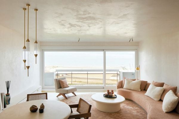 Book cover of Contemporary Living Yearbook 2023, with a dark grey interior of slate tiles, and a modern steel fireplace with logs. Published by Beta-Plus.