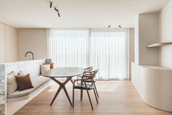Book cover of Contemporary Living Yearbook 2023, with a dark grey interior of slate tiles, and a modern steel fireplace with logs. Published by Beta-Plus.