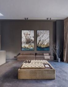 Book cover of Designer's Next, featuring an interior living area with cream linen covered sofas, brown leather chairs, white walls, and ceiling beams. Published by Beta-Plus.