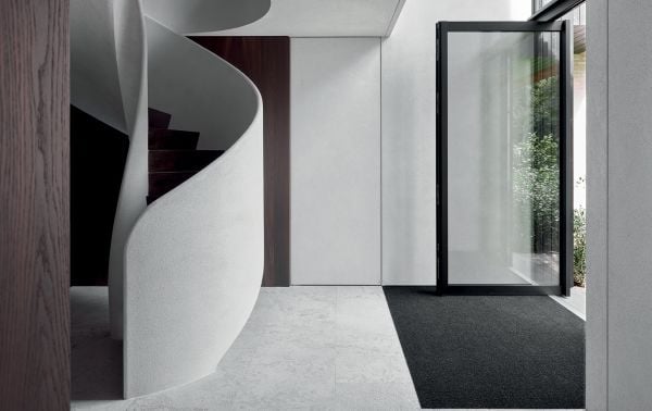 Book cover of Signature Interiors with a marble interior and dark wall panelling. Published by Beta-Plus.