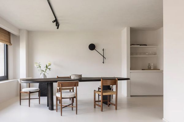 Book cover of Contemporary Living Yearbook 2025, with an interior living room with brick fireplace, pale walls and dark wood furniture. Published by Beta-Plus.