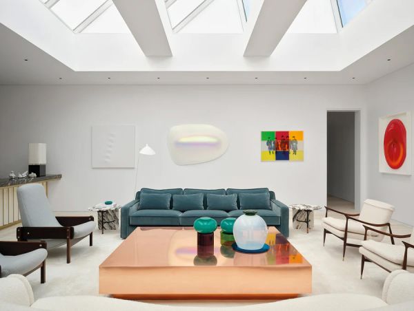 Book cover of Contemporary Living Yearbook 2025, with an interior living room with brick fireplace, pale walls and dark wood furniture. Published by Beta-Plus.