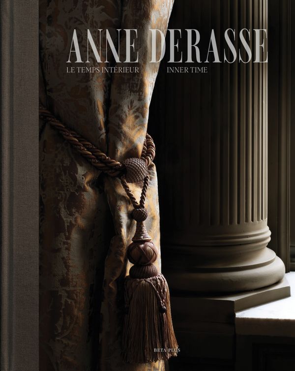 Book cover of Anne Derasse: Inner Time, with an interior room with curtain with tassel tie and stone column behind. Published by Beta-Plus.