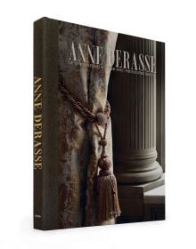 Book cover of Anne Derasse: Inner Time, with an interior room with curtain with tassel tie and stone column behind. Published by Beta-Plus.