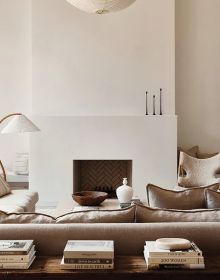 Book cover of Timeless Residences, with a pale interior hallway with stone tiled floor and two dark wood chairs with white upholstery. Published by Beta-Plus.