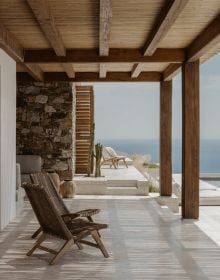 Book cover of Summer Residences, with interior living space with cream carpet, wood furniture, with double doors opening out to landscape. Published by Beta-Plus.