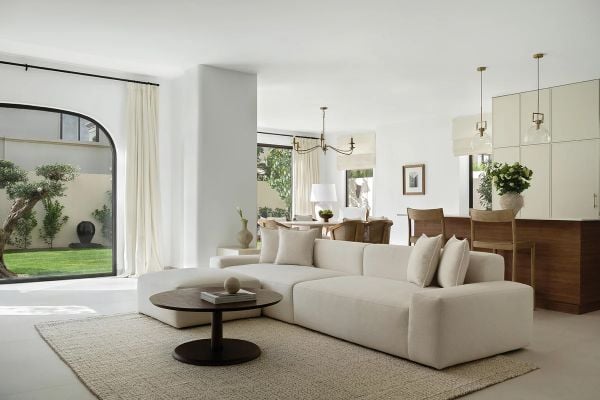 Book cover of Contemporary Living in the Middle East, with a cream interior living room with wood ceiling beams. Published by Beta-Plus.