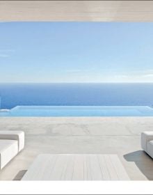 Book cover of The Essence of Contemporary Mediterranean Living: Ramón Esteve; featuring an outside residential terrace with infinity pool. Published by Beta-Plus.