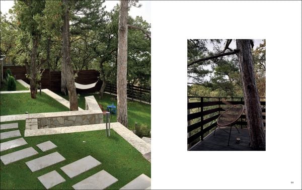 Book cover of Alpine Elegance: High-End Mountain Homes, featuring a cozy house with a view of snow topped mountains through the large windows. Published by Beta-Plus.